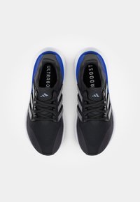 Black athletic sneakers featuring a textured upper, blue accents, three white stripes, and a white sole with visible cushioning.