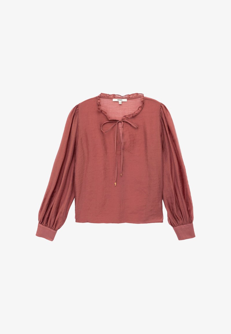 Blouse rose en tissu léger, avec un col froncé, un détail à nouer et de longues manches voluminueuses avec des poignets ajustés.