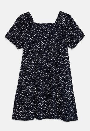 Marineblaue Kleid mit kurzen Ärmeln, quadratischem Ausschnitt, gestuftem Design und verstreuten weißen Punkten. Weicher Stoff, knielanger Schnitt.
