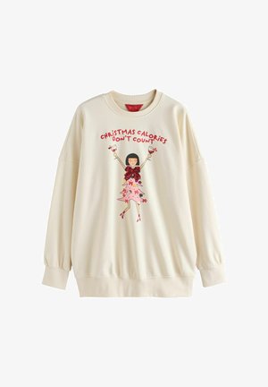 Cremfarbener Kapuzenpullover mit langen Ärmeln, der ein buntes Grafikmotiv einer Figur zeigt, umgeben von dem Text "WEIHNACHTSKALORIEN ZÄHLEN NICHT."