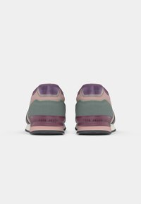 Sneakers with a green upper, pink and purple accents, cushioned heel, and black rubber sole. Back features 'Pepe Jeans' branding.