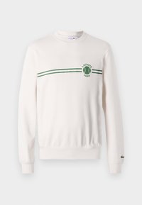 White crewneck sweatshirt made of cotton, featuring a green striped pattern and logo at the chest. Ribbed cuffs and hem.