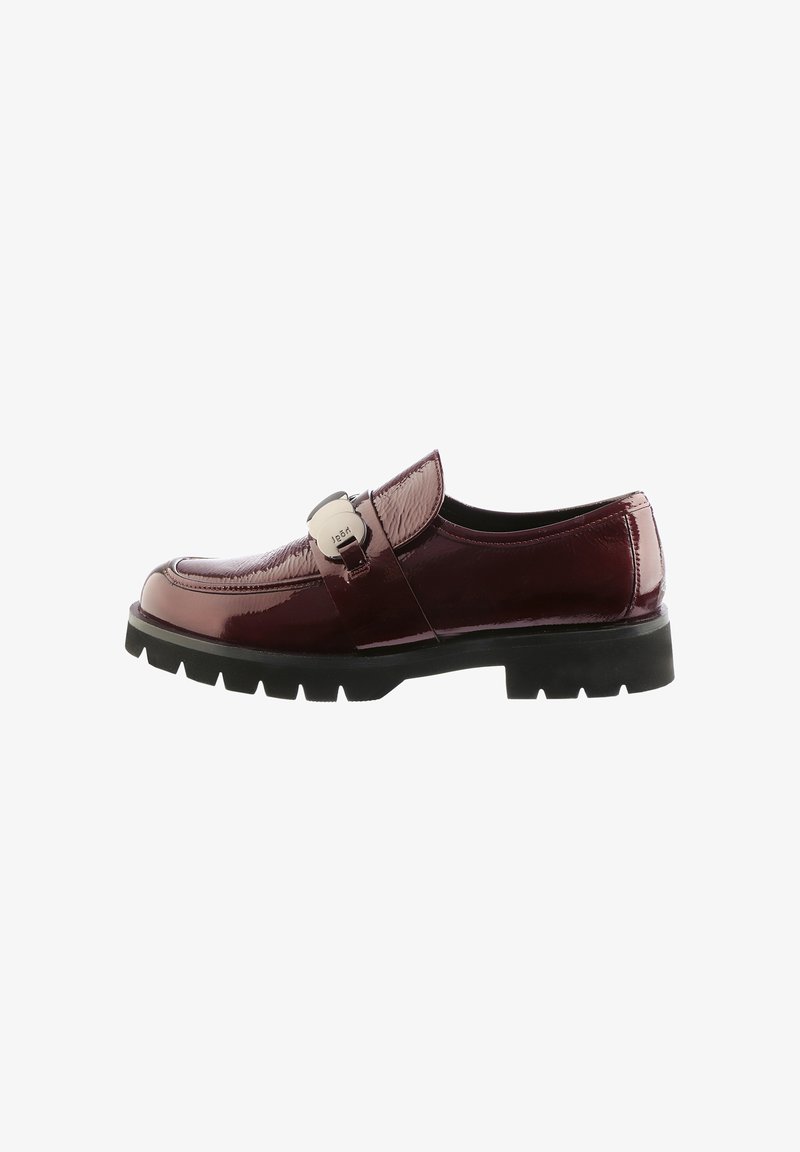 Burgundy patent leather loafer with textured upper, black rubber sole, and silver buckle detail on the vamp. Classic, low-profile design.
