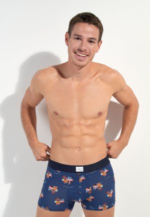 Boxershorts i navy med et stribet mønster, der har farverige tegneserie-motorcykler. Lavet af blødt stof med en behagelig taljeelastik.