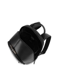 Black leather backpack with open main compartment showing interior pockets and padded shoulder straps on white background.