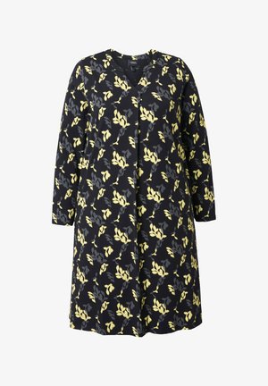 Musta mekko, jossa on keltainen ja harmaa lehtikuviot, v-pääntie, pitkät hihat ja rento malli. Pehmeä kangas, jolla on sileä tekstuuri.