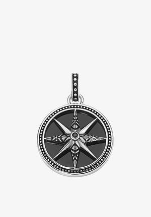 Silver compass pendant featuring a black background, intricate star design with textured details, and a beaded border.