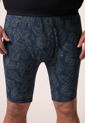 Shorts de bain bleus à motifs présentant un design de feuilles et une coupe ajustée, fabriqués en tissu extensible avec une taille noire contrastante.
