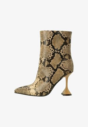 Pointed-toe ankle boot in faux snakeskin pattern, featuring beige and black tones, a fitted design, and a unique triangular heel.