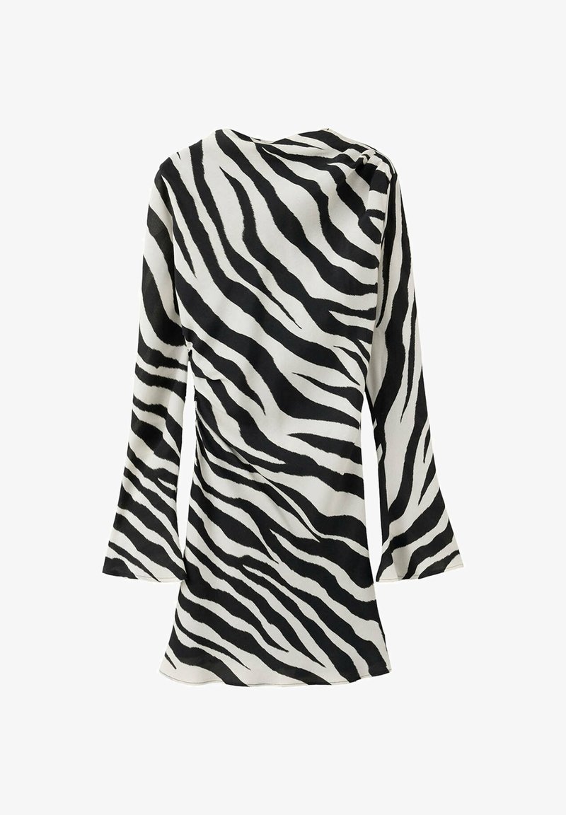 Robe mini à manches longues avec motif zèbre noir et blanc et manches légèrement évasées vue de dos.