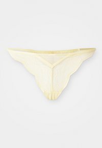 String en dentelle jaune clair avec des bords festonnés et un délicat motif floral, présenté à plat sur un fond blanc.