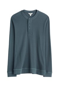 Maglietta henley a maniche lunghe color teal in tessuto a coste texturizzato, con patta button e una vestibilità rilassata con polsini e orlo a banda.