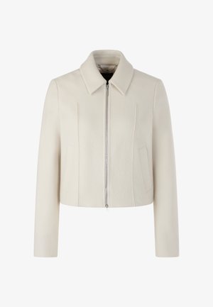 Cropped cream jacket in soft, textured fabric. Features a straight collar, front zip closure, and two side pockets with stitched details.