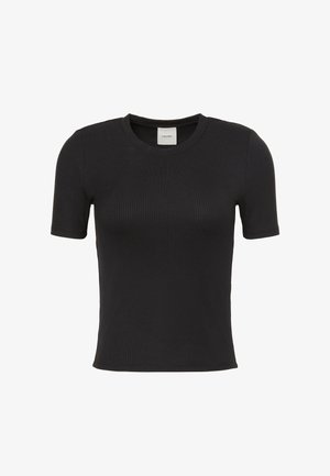 Camiseta negra de canalé Calvin Klein de manga corta con cuello redondo y silueta ajustada, mostrada sobre un fondo blanco liso.