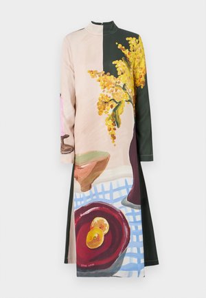 Long sleeve dress featuring a divided design with a floral print in yellow and green on one side and a colorful still life on the other.
