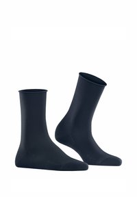 Marineblaue Socken aus glattem, elastischem Material. Sie haben einen gerippten Bund und ein nahtloses Zehendesign.