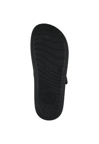 Zwarte rubberen schoenzool met een getextureerd, golvend patroon voor grip. Beschikt over een ronde vorm en een cirkelvormig schokabsorberend detail.