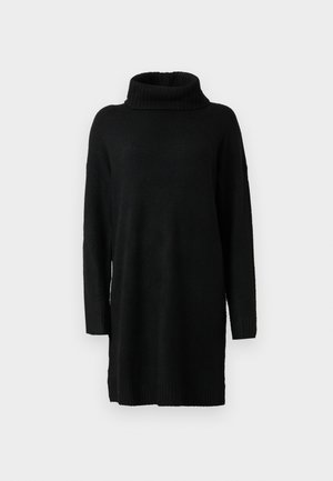 Pull en maille noir à col roulé avec manches longues, coupe ample, poignets et bas côtelés. Texture douce et design minimaliste.