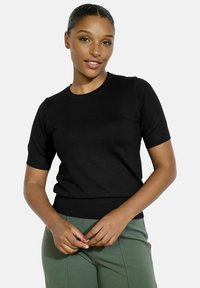 Black short-sleeve sweater made of soft knit material, featuring a crew neckline and ribbed cuff and hem details. Suitable for casual wear.