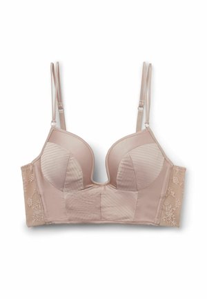 Soutien-gorge long beige clair avec doubles bretelles réglables, bonnets moulés, texture de tissu rayé et panneaux latéraux en dentelle florale.