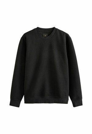 Hanorac negru cu un design texturat tip waffle, decolteu rotund și mâneci lungi. Are manșete și tiv din material elastic pentru o fixare strânsă.