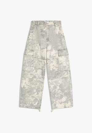 High-waisted, wide-leg cargo pants in gray and white acid wash with large front pockets and drawstring hems.
