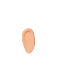 Flytende foundationprøve i en ferskenfarget beige nyanse, glatt tekstur, blank finish, med en subtil glød på en hvit bakgrunn.