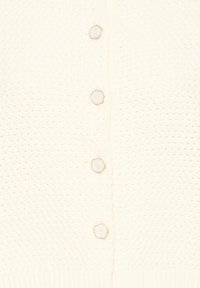 Kootud kreemjas kardigan tekstuurse mustriga, millel on viis kuusnurkset nööpi ja soonikkoes serv. Kerge ja hingav kangas.