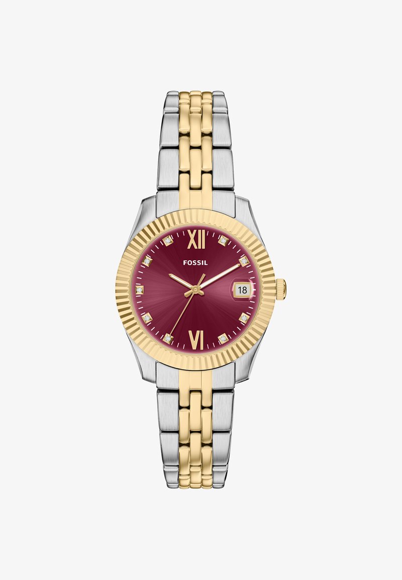 Orologio Fossil con quadrante color bordeaux, dettagli dorati, bracciale in metallo bicolore argento e oro, e finestra per la data alle 3. Presenta indicatori con numeri romani.