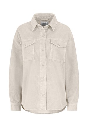 Cream corduroy shirt jacket featuring a collar, two chest pockets, and front button closure. Ribbed texture with a relaxed fit.