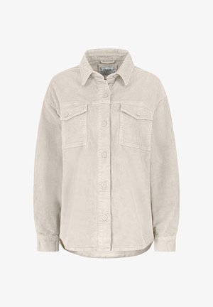 Cream corduroy shirt jacket featuring a collar, two chest pockets, and front button closure. Ribbed texture with a relaxed fit.