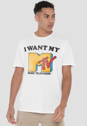 White cotton t-shirt featuring a bold, colorful graphic that reads "I WANT MY MTV" with a large yellow "M." Short sleeves and crew neck design.