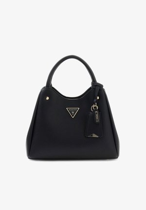Black leather Guess handbag with rounded handles, gold logo triangle, and attached keychain tag on white background.