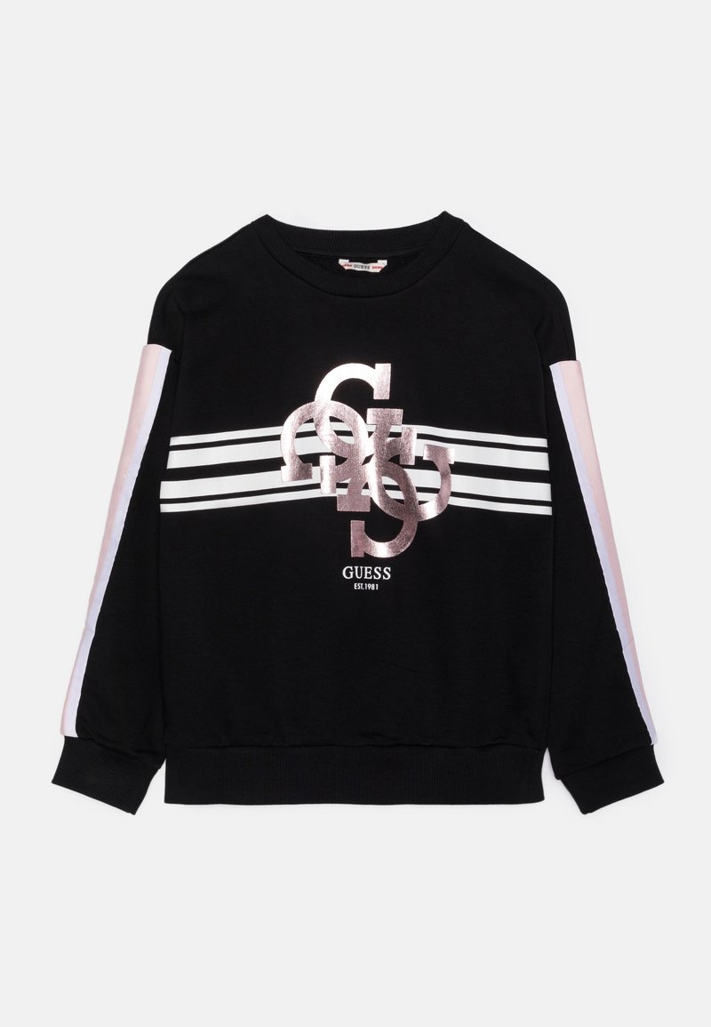 Sweat-shirt noir avec des rayures blanches et rose clair sur les manches, des rayures horizontales blanches sur la poitrine et un logo Guess brillant et superposé au centre.