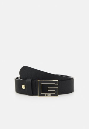 Ceinture en cuir noir texturé avec une grande boucle dorée "G" et un petit clou rond doré avec logo embossé sur la sangle.
