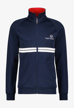 Jūras spēku treniņjaka ar sarkanu iekšējo apkakli, apmēram ar baltām horizontālām svītrām un logotipu augšējā kreisajā pusē. Ar rāvējslēdzēja aizdari un ribota apkakle.