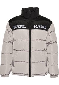 Doudoune avec panneau supérieur noir sur la poitrine, corps et manches gris clair, fermeture éclair avant et logo "KARL KANI" en blanc sur la poitrine.