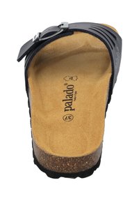 Black leather sandal with a cork footbed, adjustable strap, and textured sole. Features cutouts on the upper for breathability.