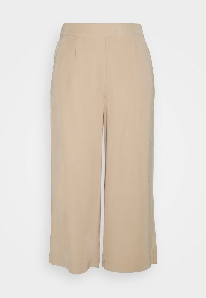Pantalon beige à jambes larges et coupé, taille haute et plis devant, présenté sur un fond clair uni.