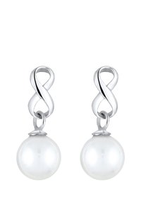 Boucles d'oreilles en argent avec un haut en forme d'infini et une perle blanche en goutte. La perle est brillante, lisse et de forme sphérique.