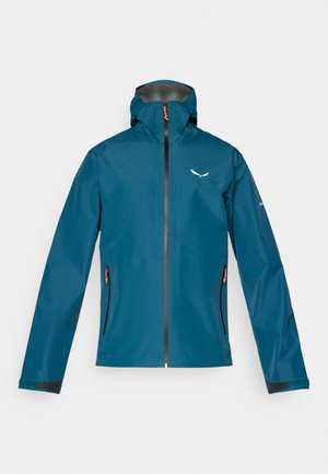 Tengeréskék vízálló dzseki struktúrált kapucnival, elöl cipzárral és két oldalsó zsebbel. Fekete részletekkel és logóval rendelkezik a mellrészen.