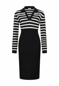 Robe en tricot avec des rayures horizontales noires et blanches, un col en V, des manches longues et des accents décoratifs sur les poignets. Silhouette ajustée.