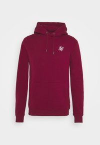 Felpa bordeaux con tasca frontale, cappuccio con coulisse e un piccolo logo bianco sul petto. Materiale in cotone con una texture morbida.