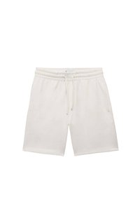 Shorts en coton blanc avec une ceinture à cordon de serrage, dotés de poches latérales et d'une texture lisse. Coupe droite classique et design jusqu'aux genoux.