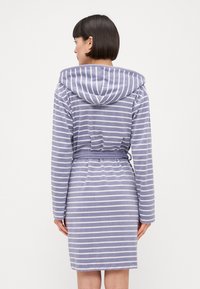 Hooded robe in light purple with white stripes, featuring a belted waist and long sleeves, made from a soft, textured fabric.