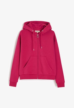 Jasnoróżowa bluza z kapturem na suwak, kaptur ze sznurkiem, przednie kieszenie, ściągacze i metalowa zawieszka zamka w kształcie pierścienia.