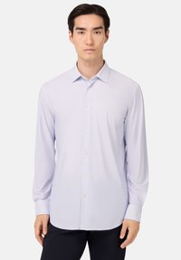 Camicia a maniche lunghe button-up di un leggero colore viola, con un fine motivo a quadretti, colletto classico e una texture di tessuto liscia. Presenta bottoni frontali.