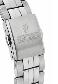Nerūsējošā tērauda pulkstenis ar matētu apdari, ar sukātu virsmu, taisnstūra formu un saistītu siksnu. Iegravēts "FESTINA" logotipa detalizējums.