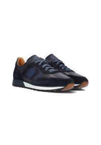 Navy blue suede and leather sneakers with light blue laces, white midsole, and brown accents on the heel. Rounded toe and cushioned design.
