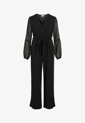 Mono negro con un diseño envolvente, largas mangas transparentes abullonadas con lunares y un cinturón de tela a la cintura. Textura suave.